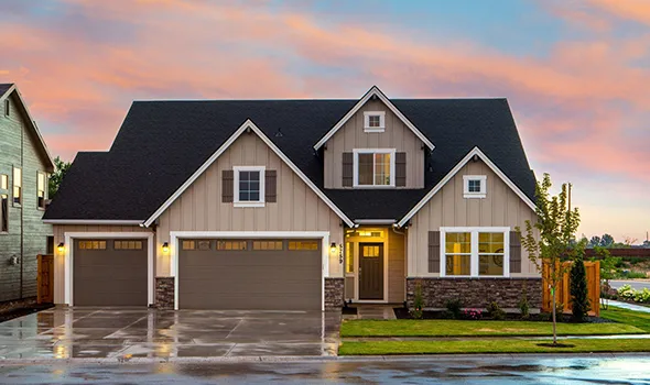 A beautiful home featuring a generous garage and inviting landscaping, presented by trusted Downsizing Real Estate Specialists.