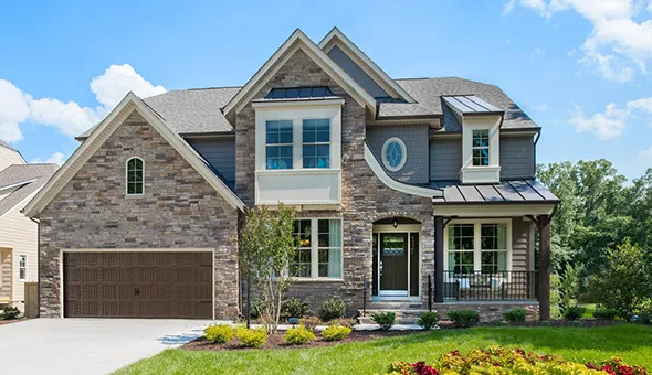 A lovely home with a roomy garage and beautiful landscaping, showcased by trusted downsizing real estate experts.